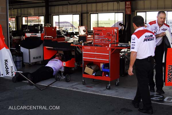 Helio Castroneves Crew working to replace Helio's car after fire